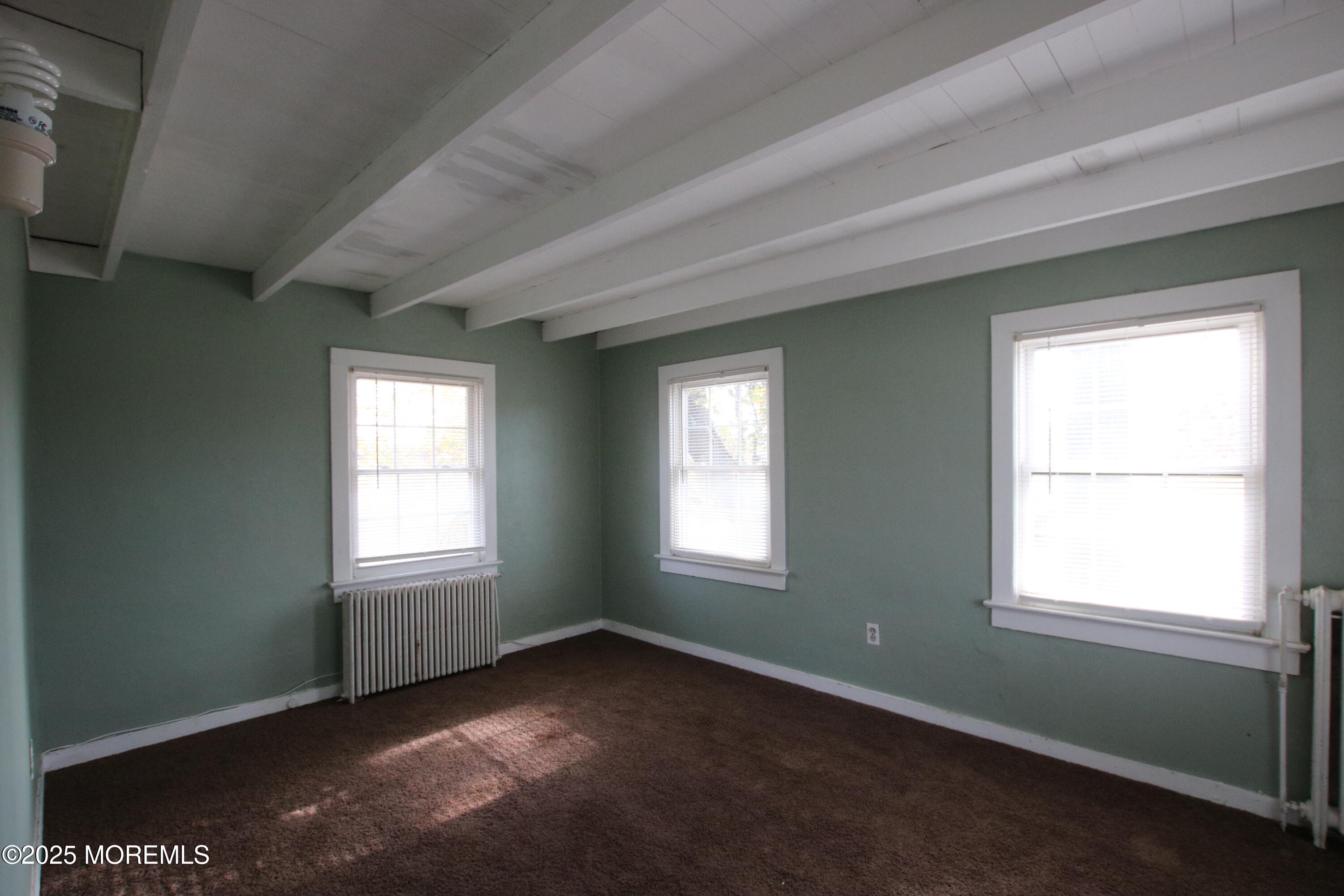 185 Monmouth Road West Long Branch, NJ 07764 - Photo 10 of 28 an empty room with a window