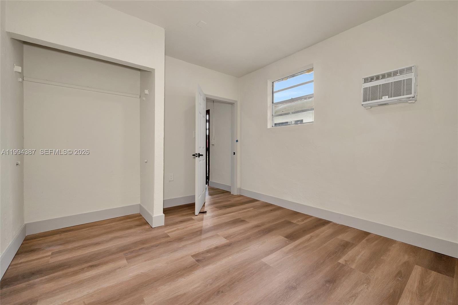 5632 Southwest 19th Street West Park, FL 33023 - Photo 18 of 43 a view of empty room with wooden floor