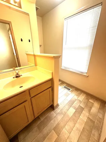 a bathroom with a sink and a mirror