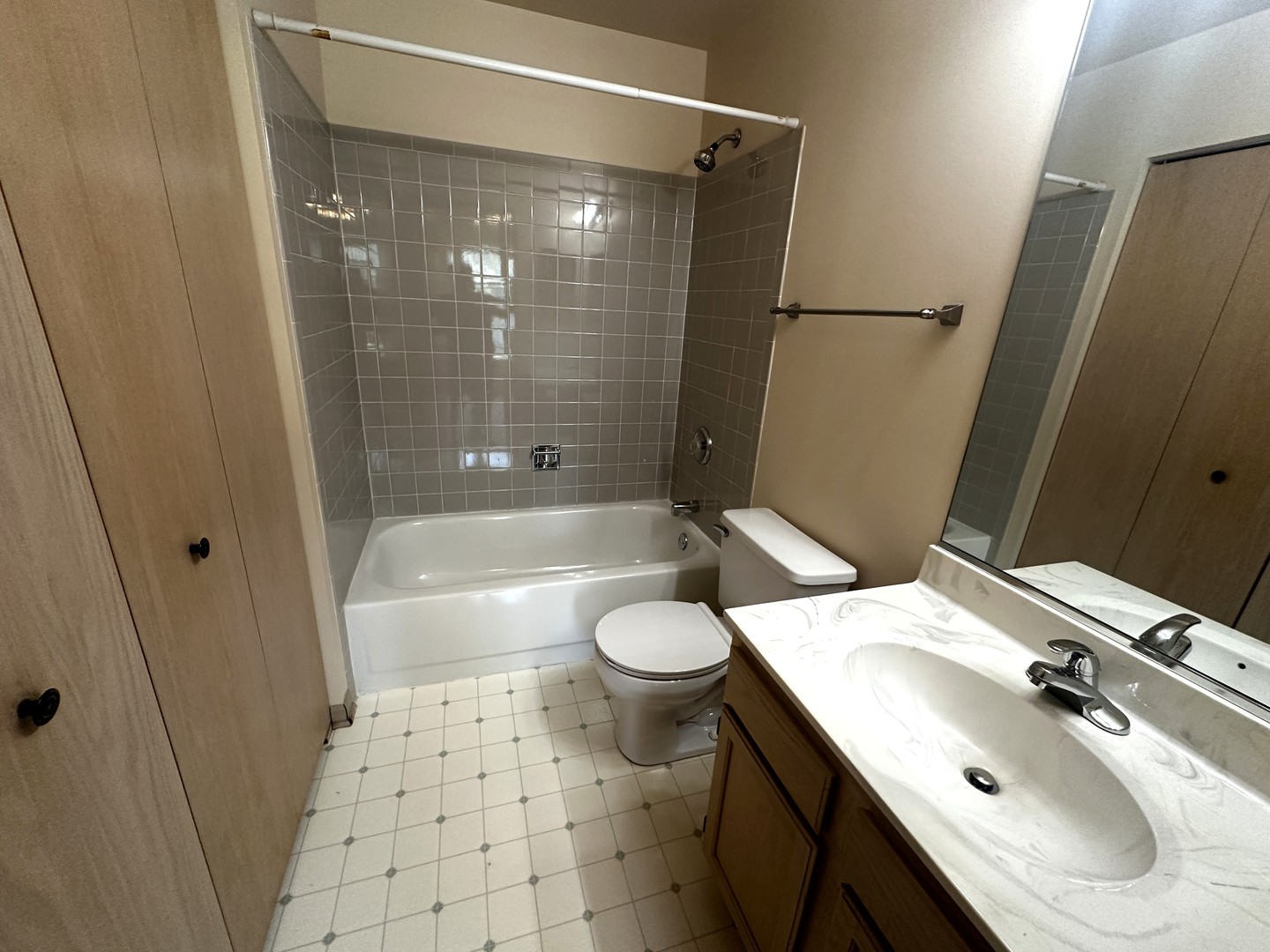 1152 Vail Court Naperville, IL 60540 - Photo 8 of 11 a bathroom with a sink toilet and shower