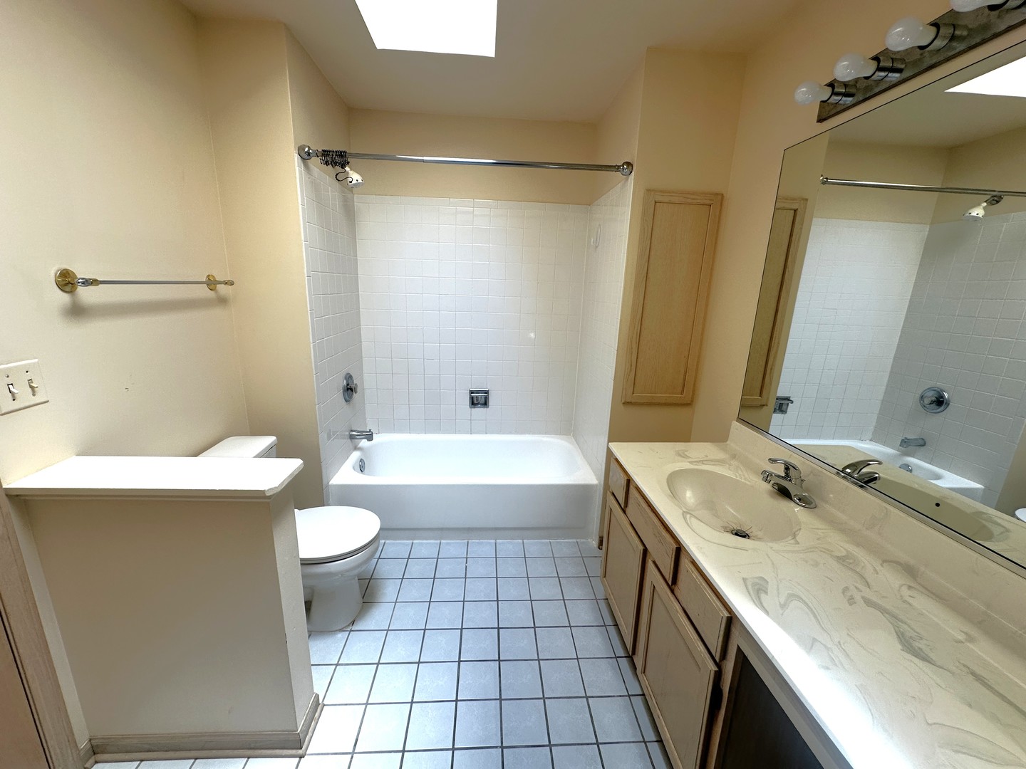 1152 Vail Court Naperville, IL 60540 - Photo 10 of 11 a bathroom with a granite countertop sink toilet mirror and bathtub