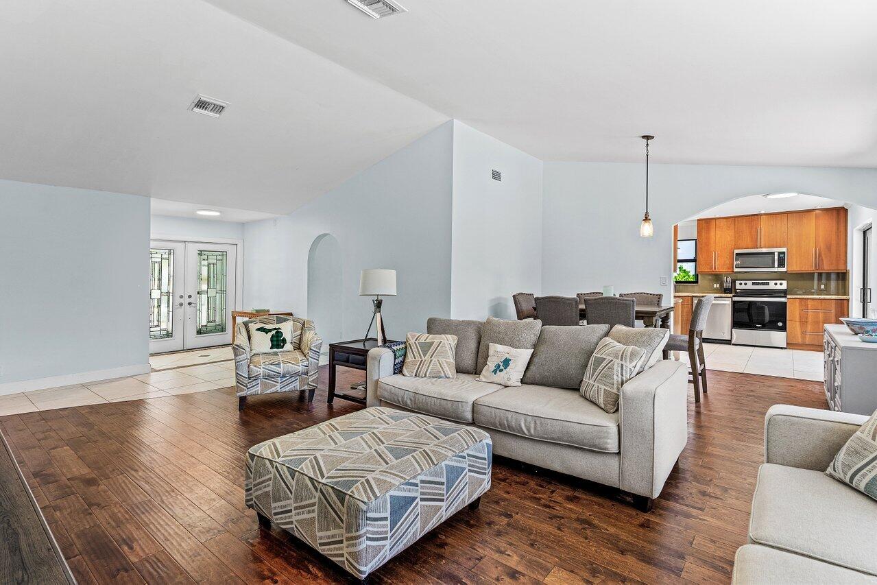 7800 Texas Trail Boca Raton, FL 33487 - Photo 7 of 33 a living room with furniture and a flat screen tv