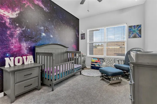 a bedroom with furniture and a window