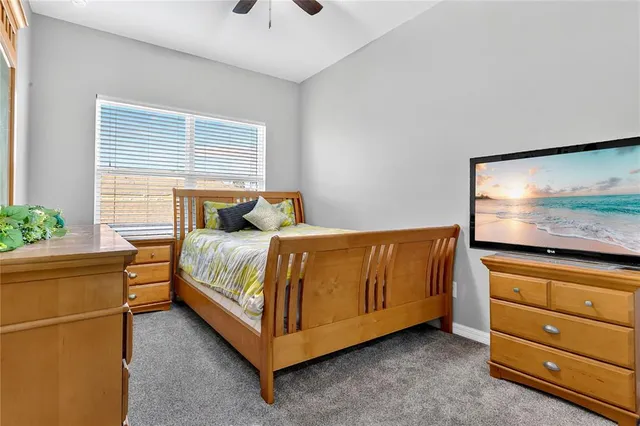 a bedroom with a bed and with furniture