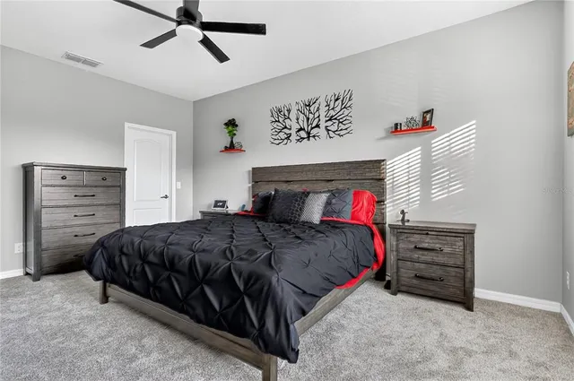 a bedroom with a bed and cabinets
