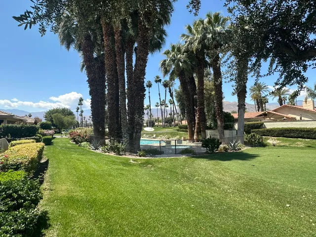 a view of backyard with green space