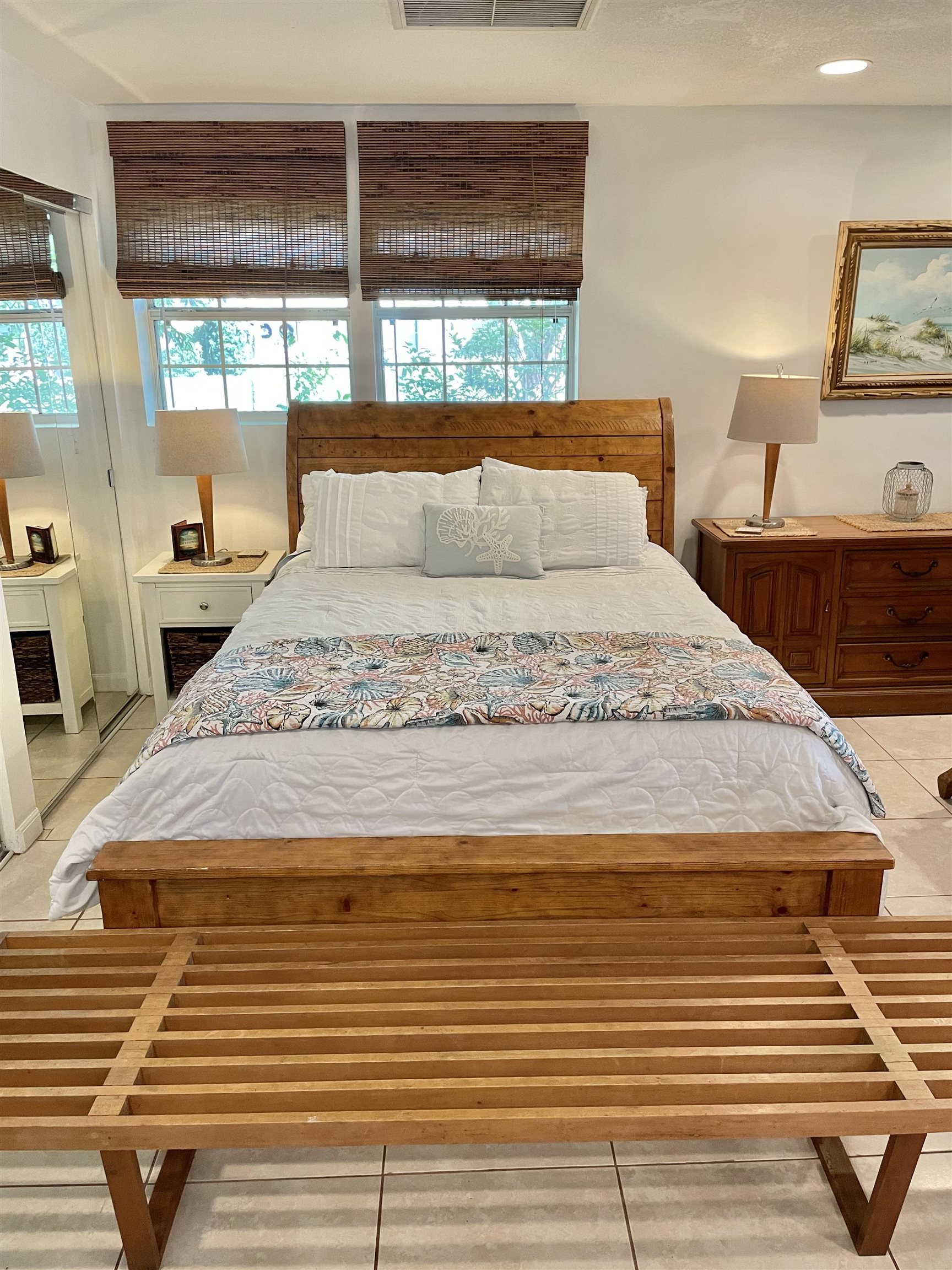 694 16th Street St. Augustine Beach, FL 32080 - Photo 6 of 14 a bedroom with a bed and large windows