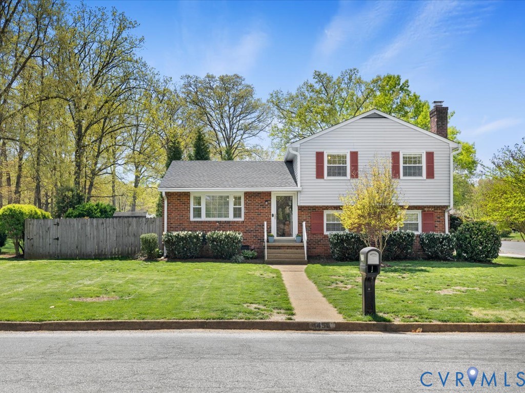 1455 Robindale Road Richmond, VA 23235 - Photo 4 of 29 a front view of a house with a yard