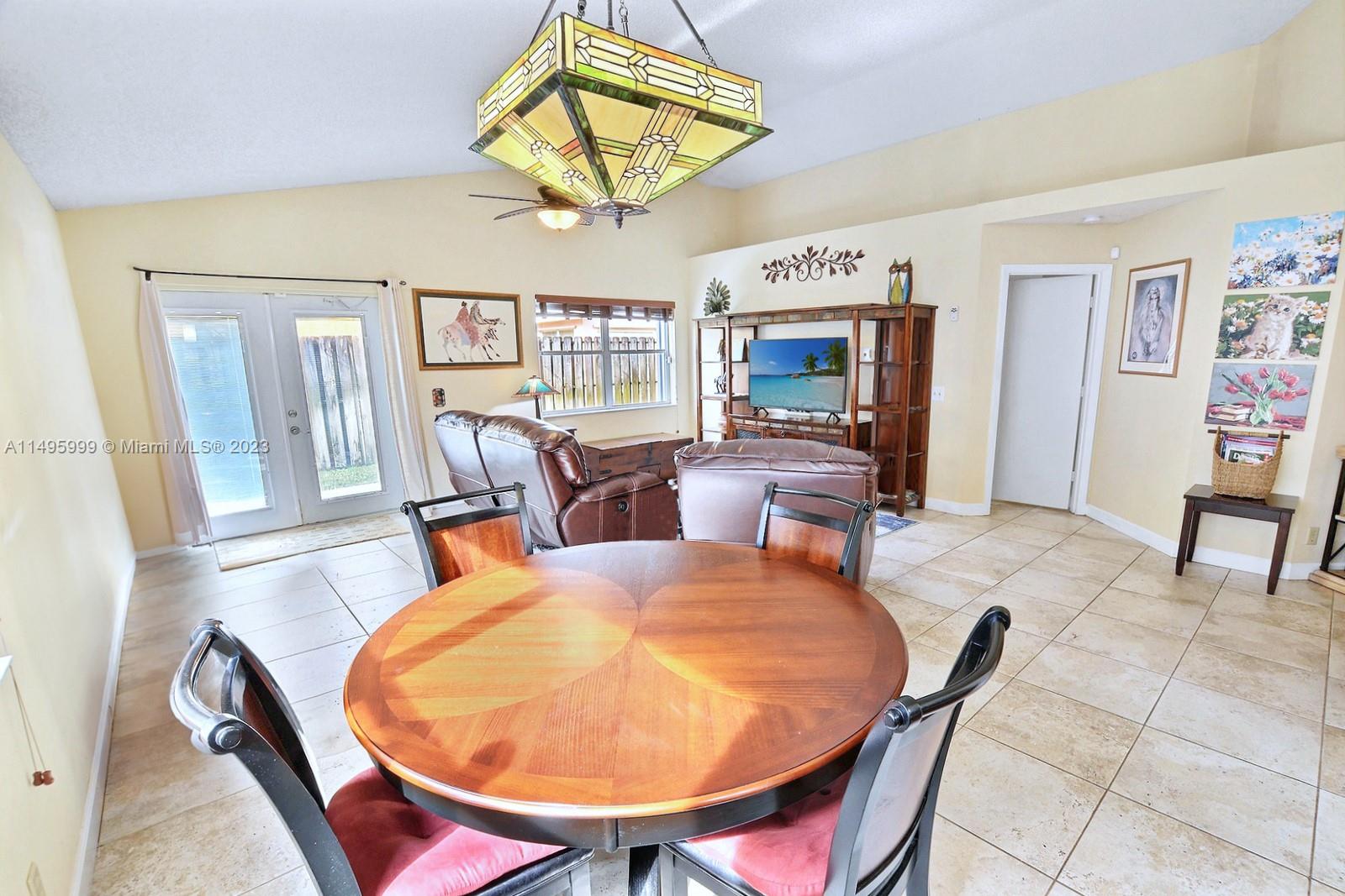Forest Ridge Cluster Homes Davie, FL 33328 - Photo 12 of 39 a dining room with furniture and window