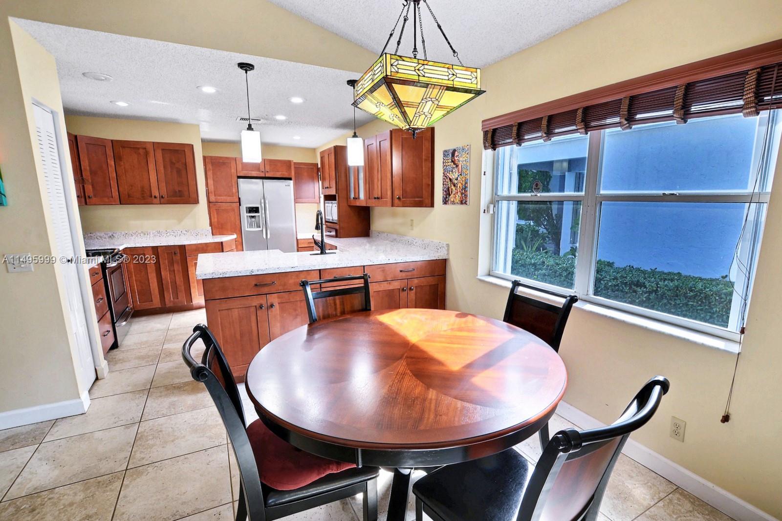 Forest Ridge Cluster Homes Davie, FL 33328 - Photo 13 of 39 a dining room with furniture and window