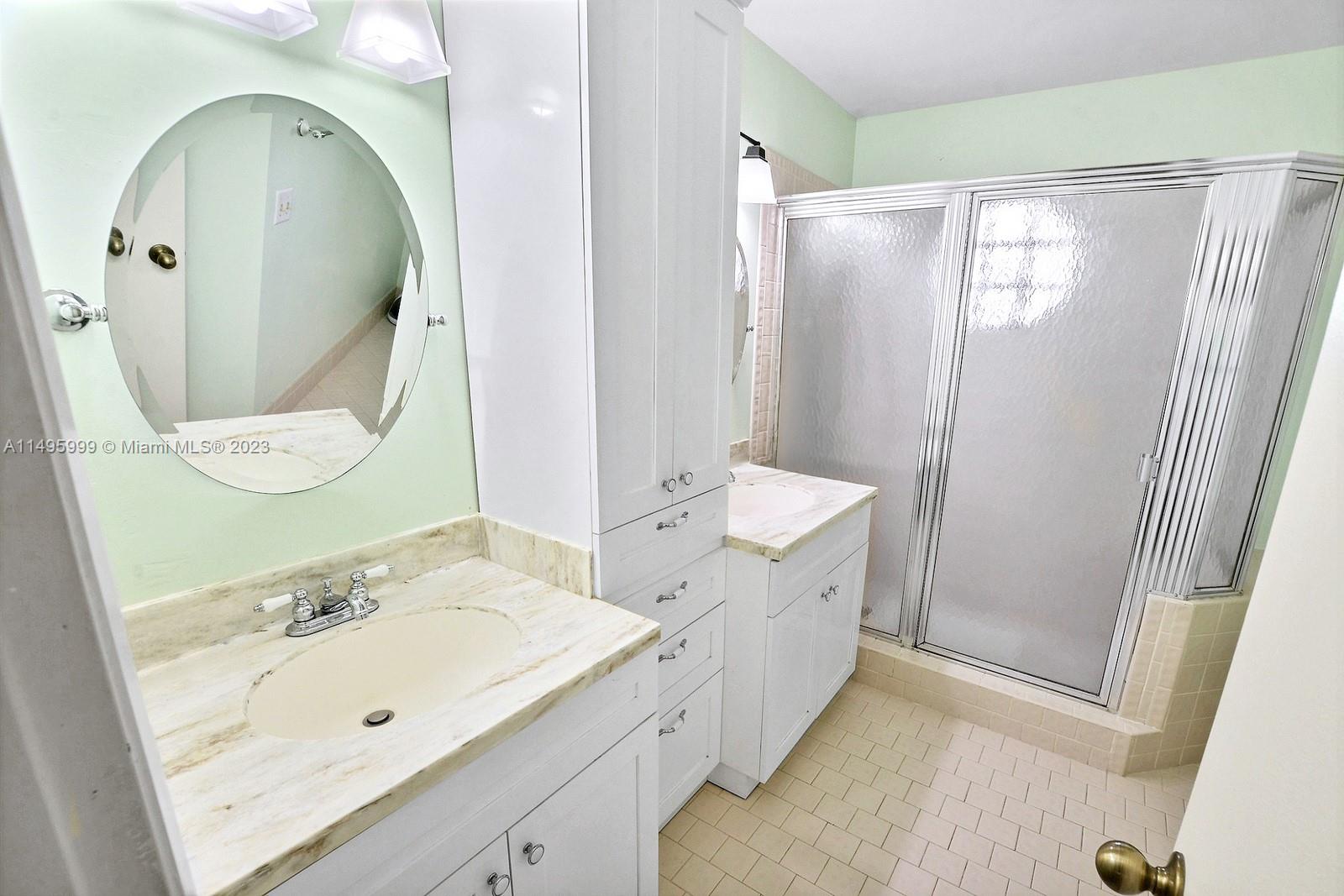 Forest Ridge Cluster Homes Davie, FL 33328 - Photo 24 of 39 a spacious bathroom with a double vanity sink mirror and shower