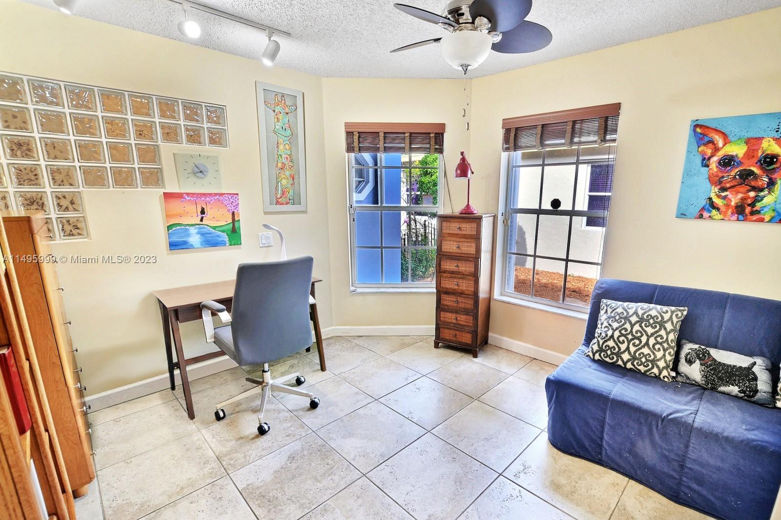 Forest Ridge Cluster Homes Davie, FL 33328 - Photo 27 of 39 a living room with furniture and a floor to ceiling window