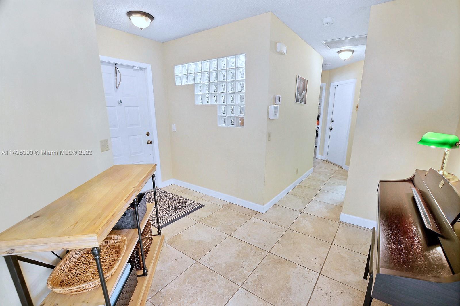 Forest Ridge Cluster Homes Davie, FL 33328 - Photo 6 of 39 a view of a hallway with furniture