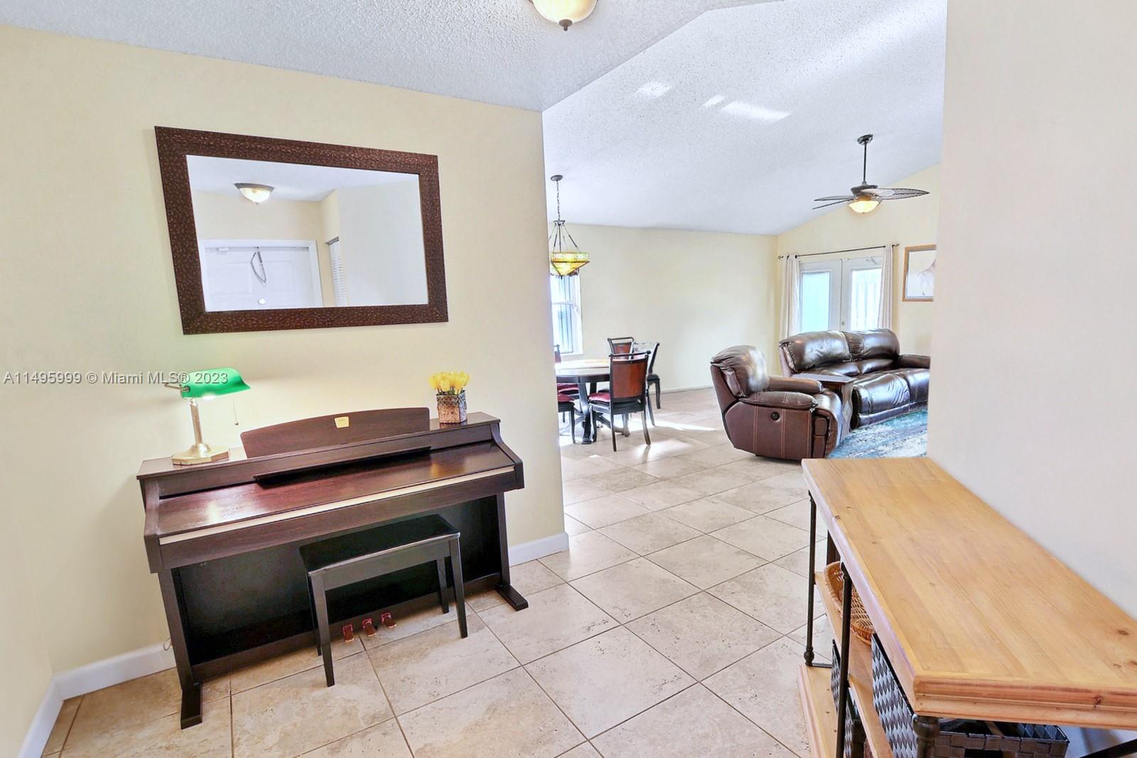 Forest Ridge Cluster Homes Davie, FL 33328 - Photo 8 of 39 a living room with furniture and a piano