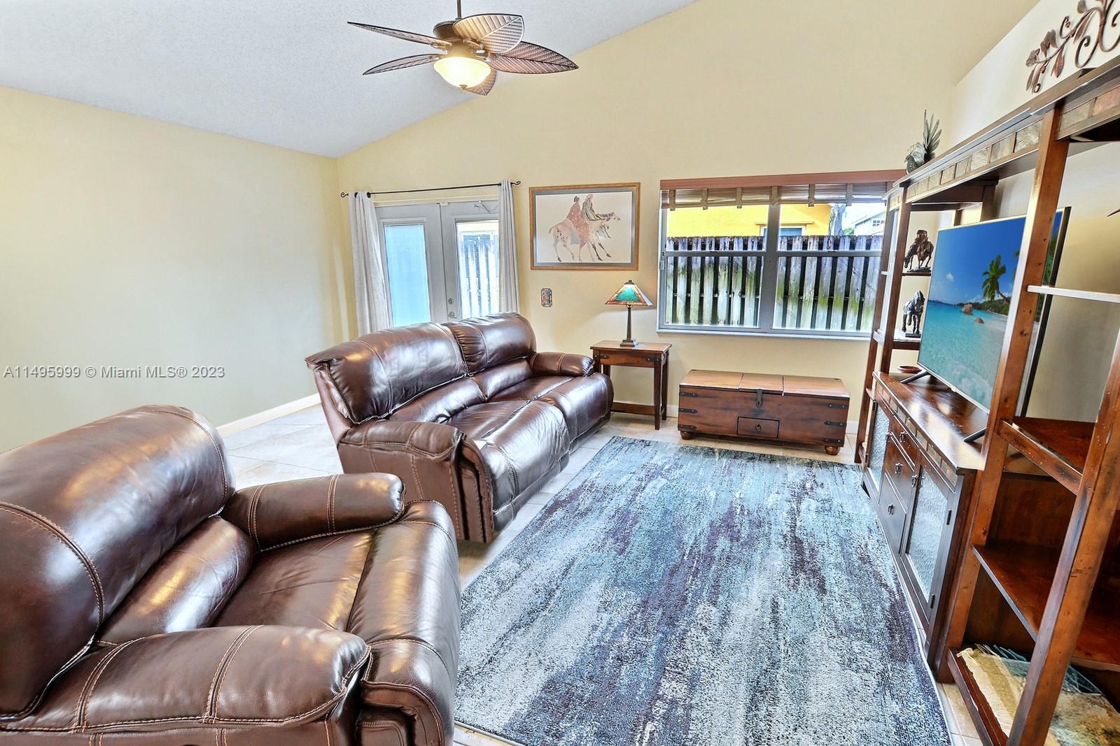Forest Ridge Cluster Homes Davie, FL 33328 - Photo 9 of 39 a living room with furniture and a wooden floor