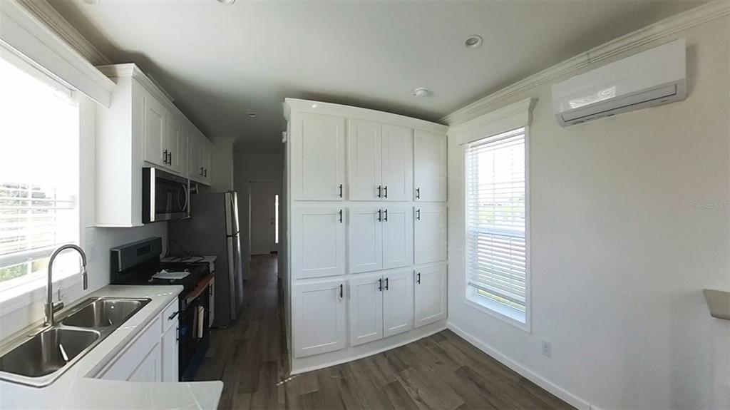 4345 Northwest 27th Place Ocala, FL 34475 - Photo 12 of 39 a kitchen with granite countertop a sink stove and refrigerator