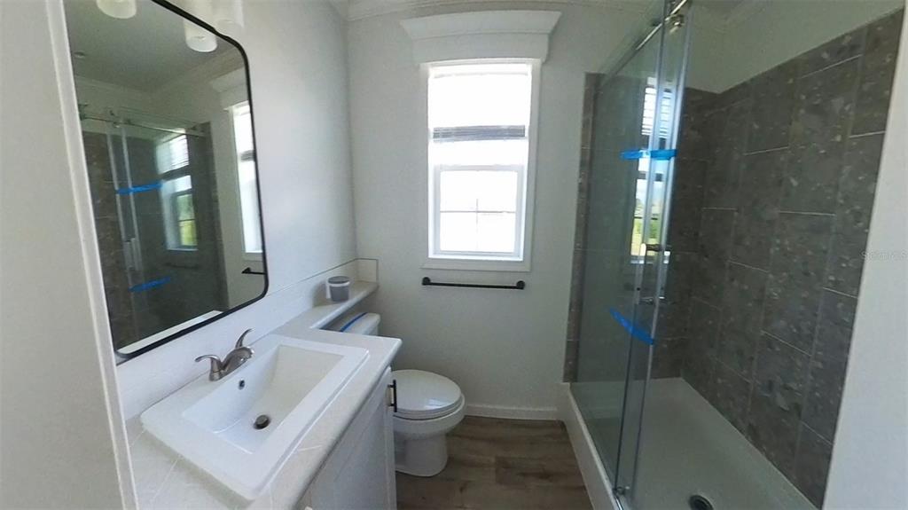 4345 Northwest 27th Place Ocala, FL 34475 - Photo 20 of 39 a bathroom with a sink a toilet and shower