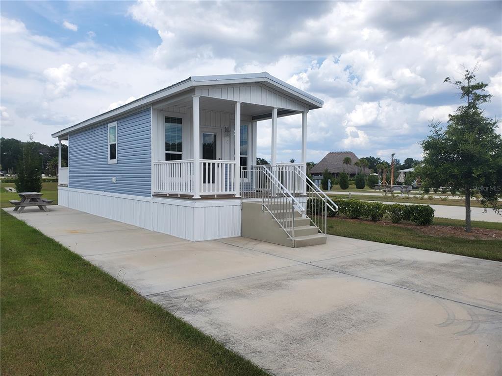 4345 Northwest 27th Place Ocala, FL 34475 - Photo 2 of 39 a view of a house with backyard and trees in the background