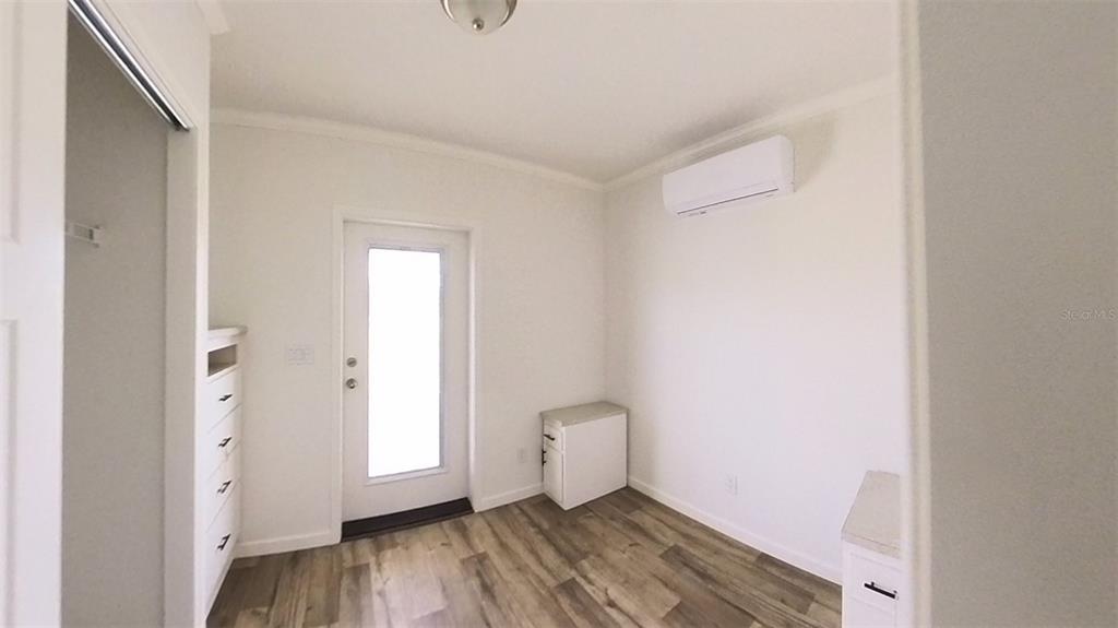 4345 Northwest 27th Place Ocala, FL 34475 - Photo 21 of 39 a view of a room with wooden floor and a toilet