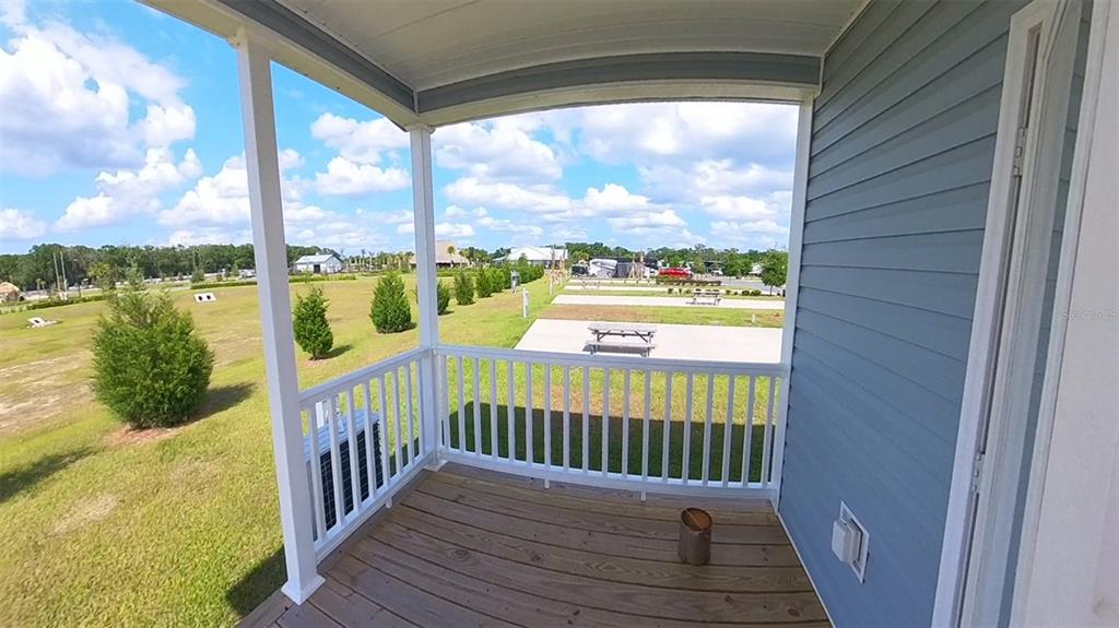 4345 Northwest 27th Place Ocala, FL 34475 - Photo 27 of 39 a view of a porch with a table