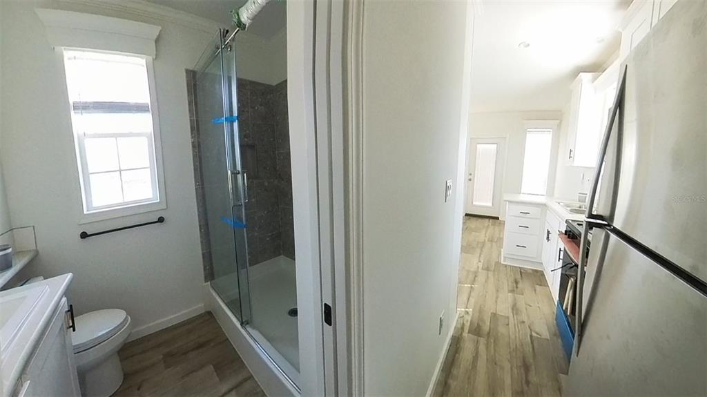 4345 Northwest 27th Place Ocala, FL 34475 - Photo 33 of 39 a bathroom with a toilet and a shower