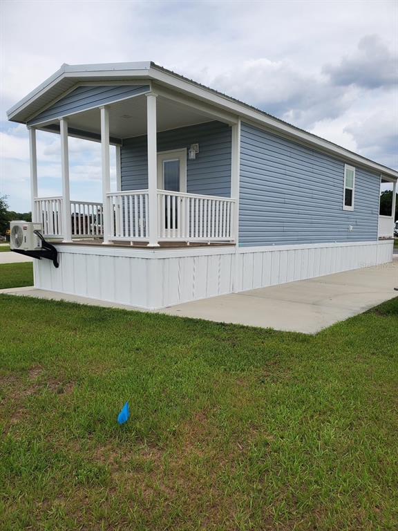 4345 Northwest 27th Place Ocala, FL 34475 - Photo 4 of 39 a view of a house with a yard