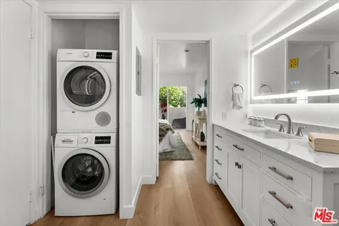 a view of a hallway with washer and dryer