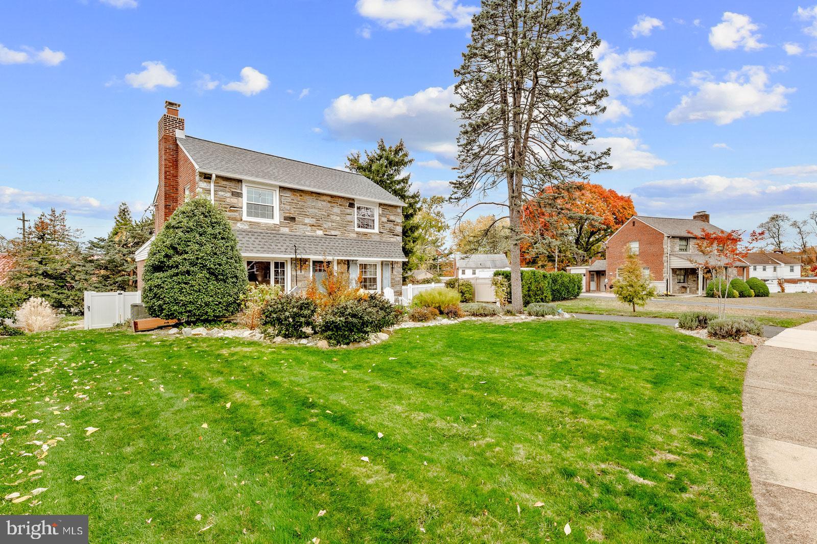 70 Meetinghouse Lane Springfield, PA 19064 - Photo 3 of 41 a front view of a house with a yard and potted plants