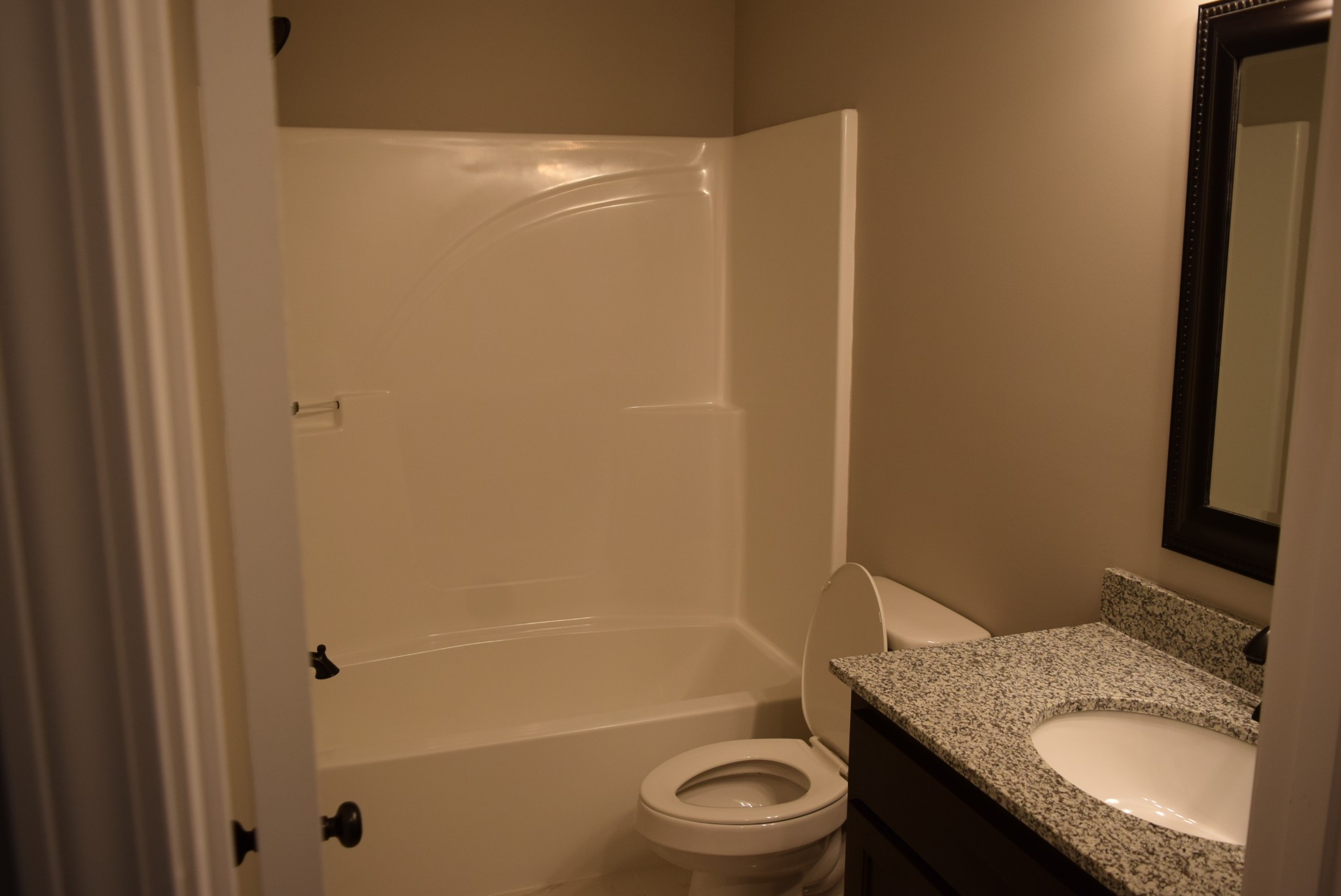 103 Ballard Road Manchester, TN 37355 - Photo 5 of 8 a bathroom with a granite countertop sink toilet and shower