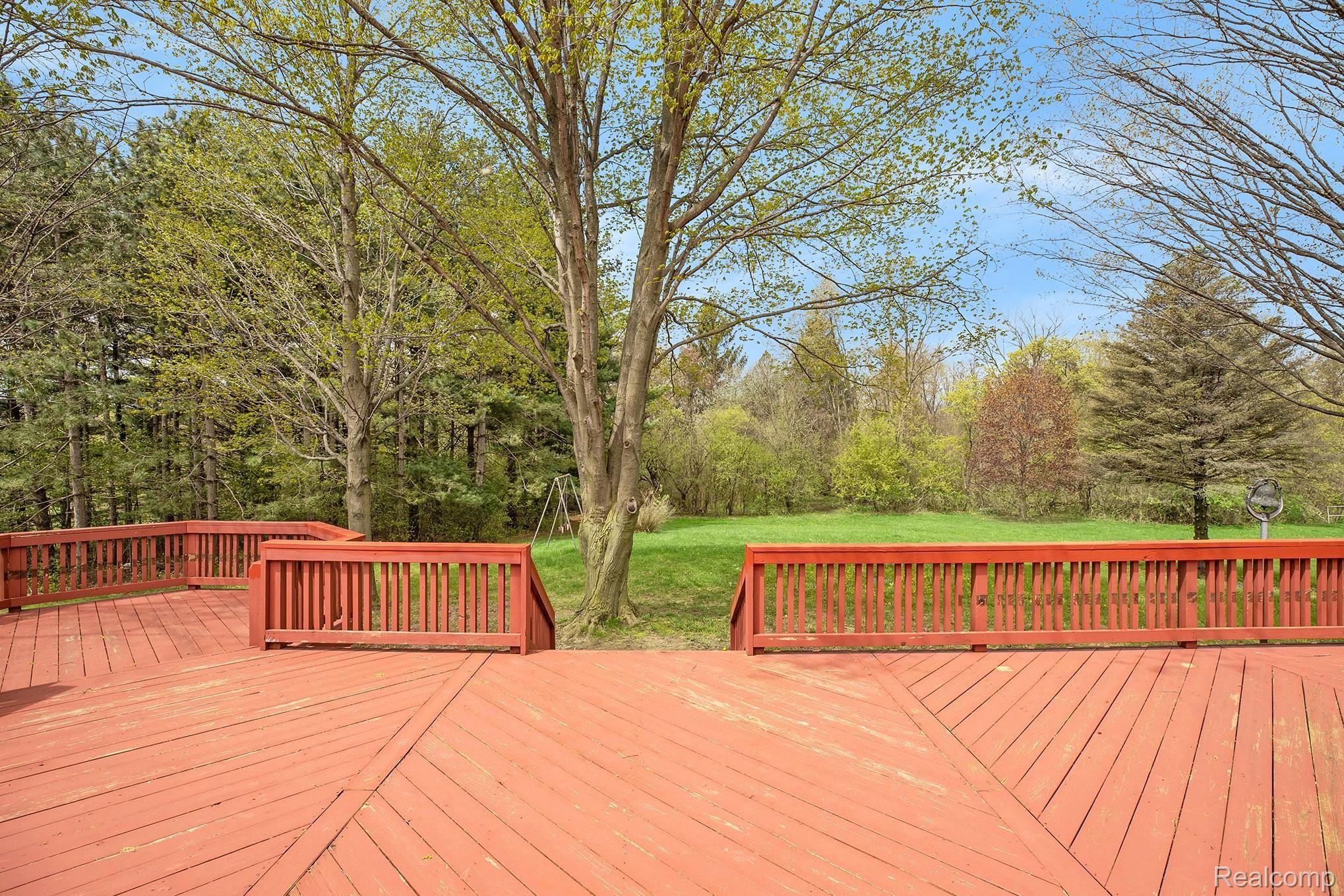 3779 Gotfredson Road Plymouth, MI 48170 - Photo 11 of 33 DECK OVERLOOKS THE YARD & WOODS