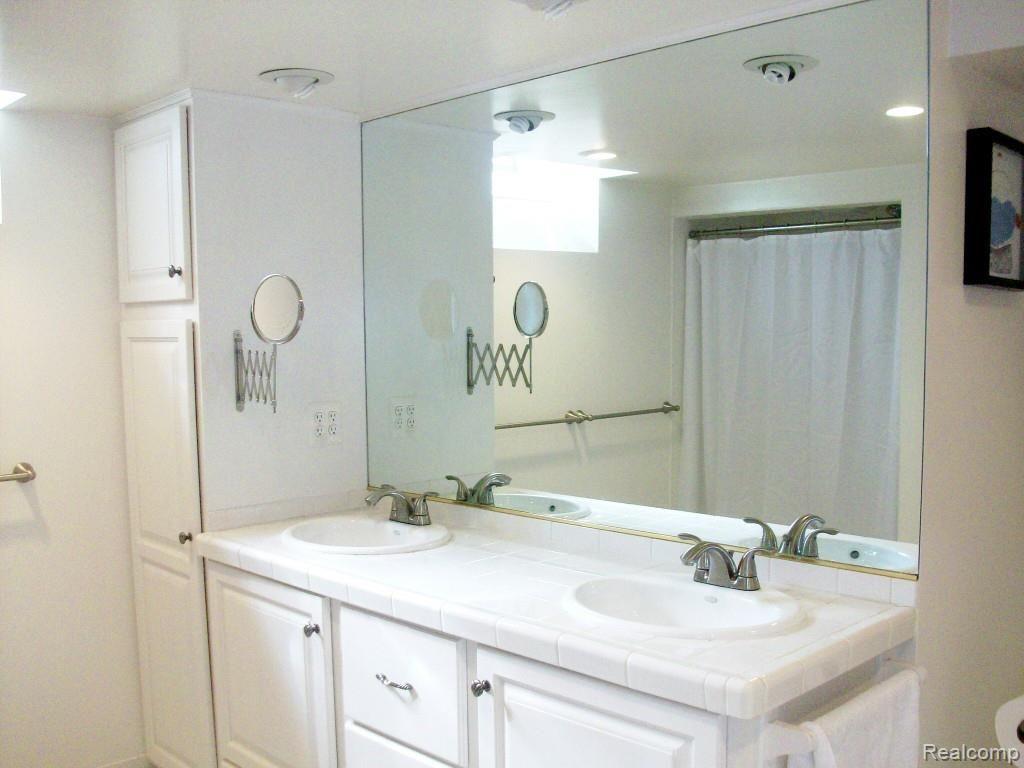 281 Reitman Court Rochester, MI 48307 - Photo 16 of 20 reitmann bsmt bath cabinet duel sinks.jpg