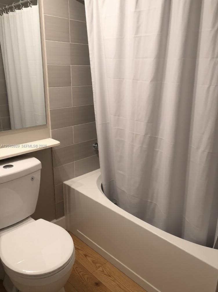 17145 North Bay Road Sunny Isles Beach, FL 33160 - Photo 1 of 6 a white toilet sitting next to a white sink