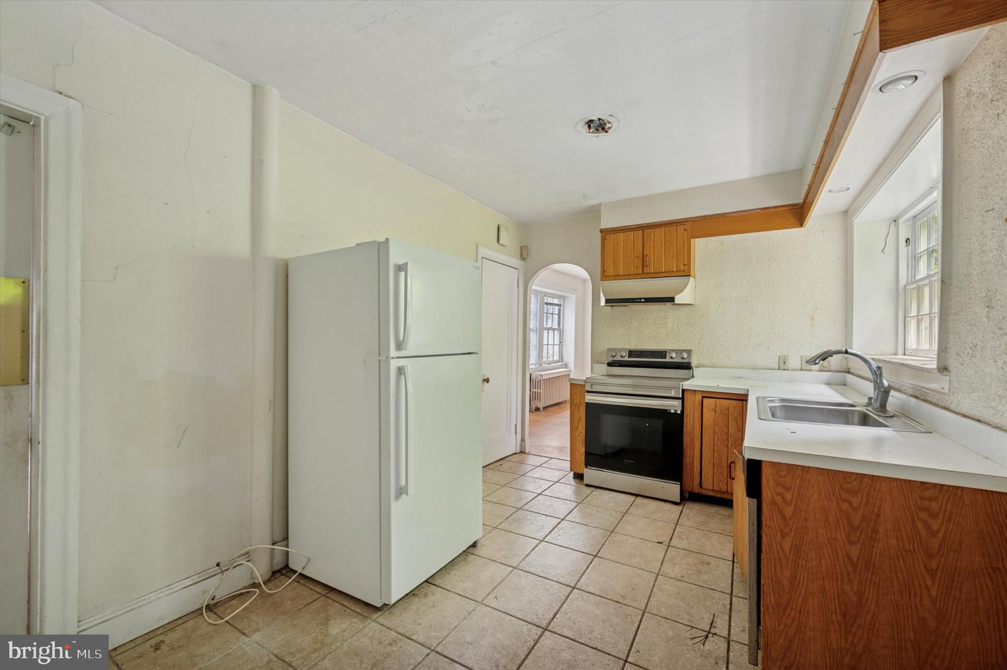 14 Rock Hill Road Bala Cynwyd, PA 19004 - Photo 4 of 15 a kitchen with stainless steel appliances granite countertop a refrigerator and a sink