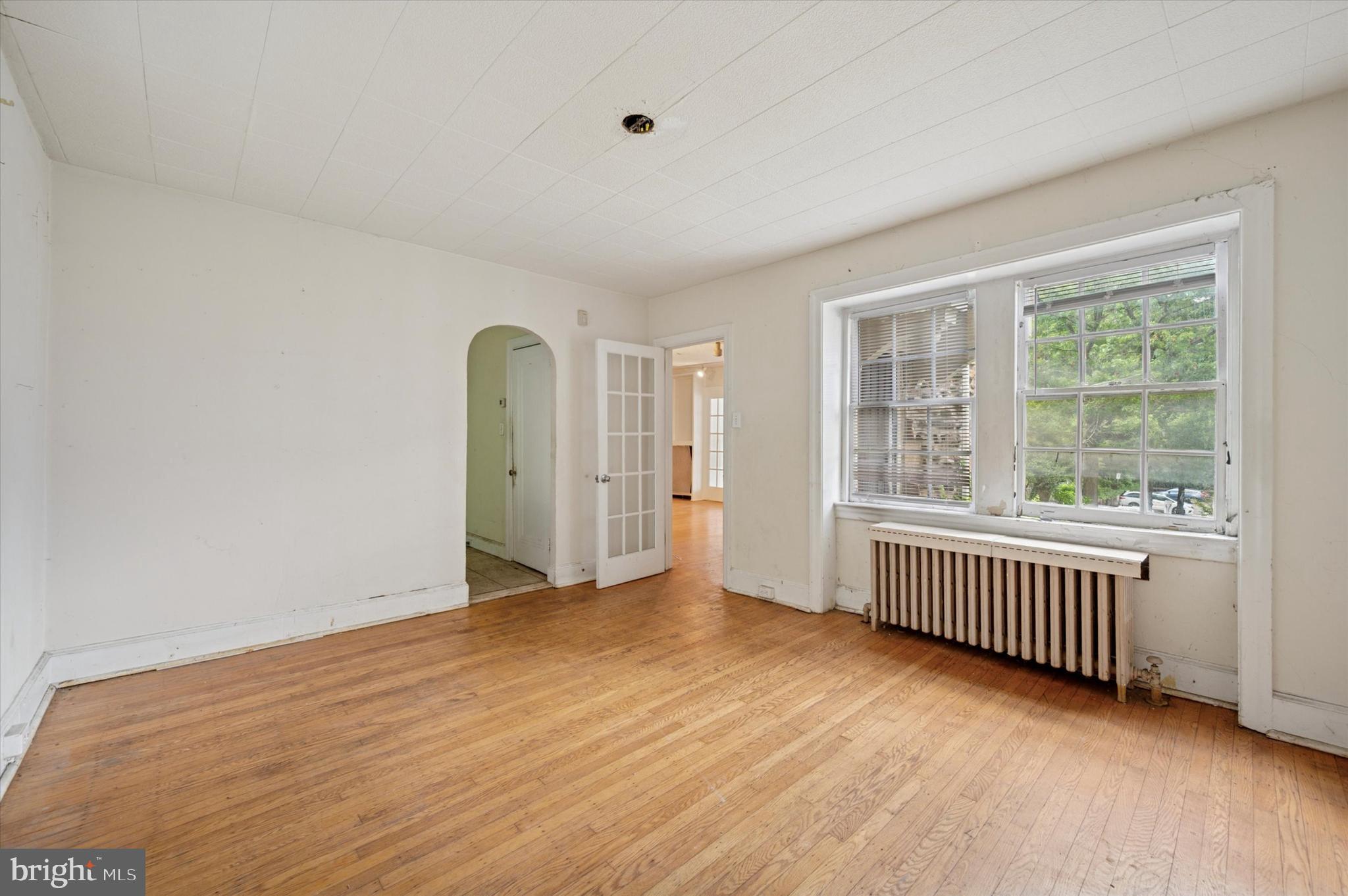 14 Rock Hill Road Bala Cynwyd, PA 19004 - Photo 7 of 15 wooden floor in an empty room with a window
