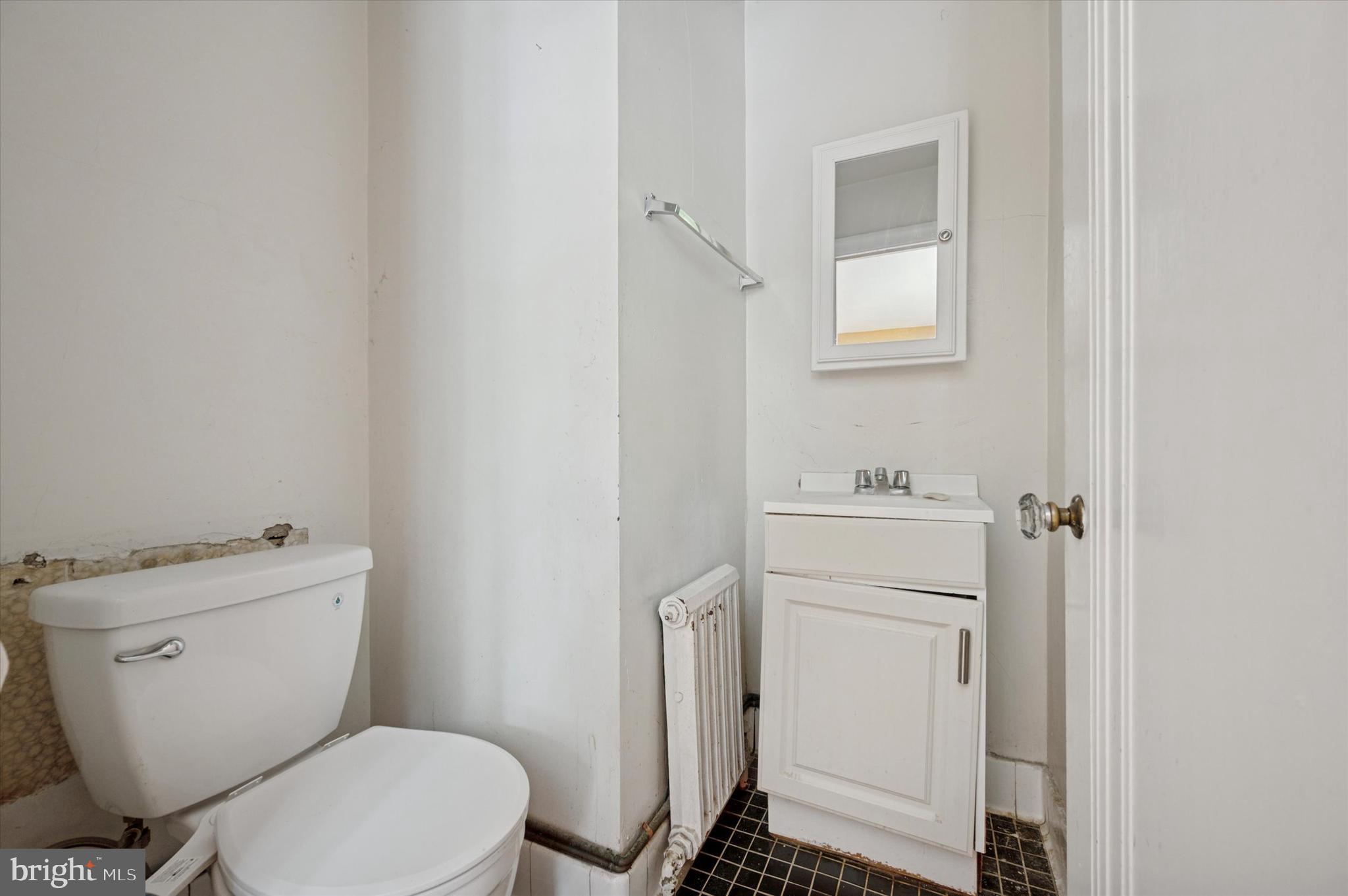 14 Rock Hill Road Bala Cynwyd, PA 19004 - Photo 10 of 15 a white toilet sitting next to a bathroom sink