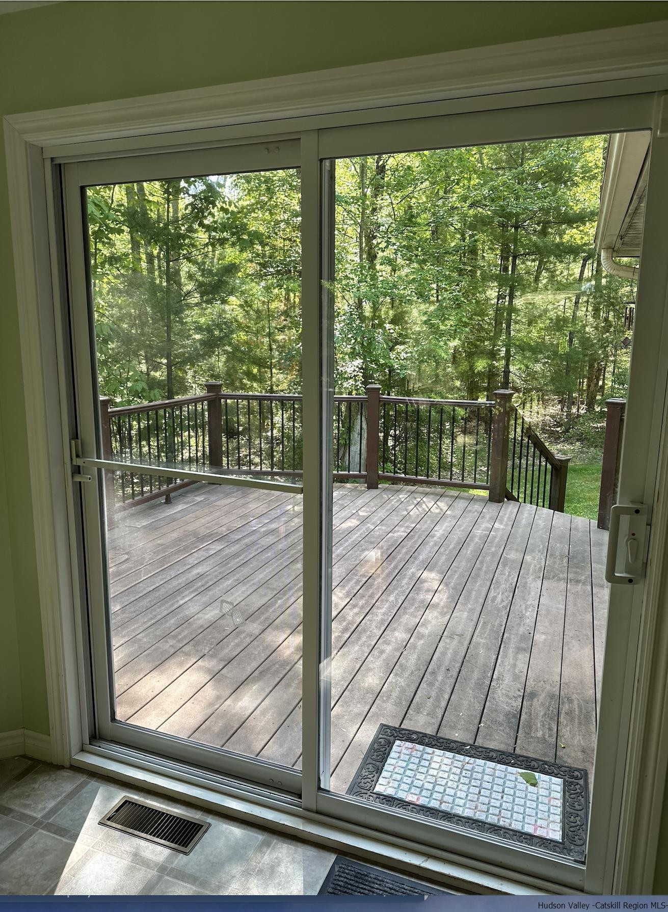 63 Lawrence Hill Road Accord, NY 12404 - Photo 11 of 19 a view of a balcony with a floor to ceiling window next to a yard