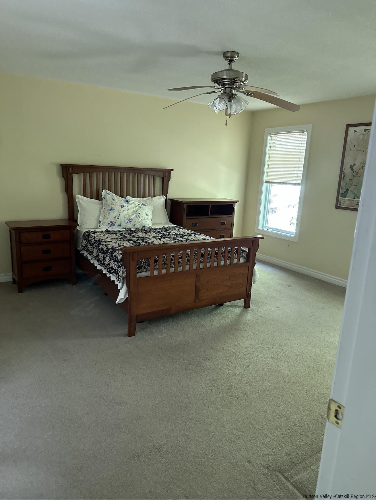 63 Lawrence Hill Road Accord, NY 12404 - Photo 12 of 19 a spacious bedroom with a bed and a chandelier
