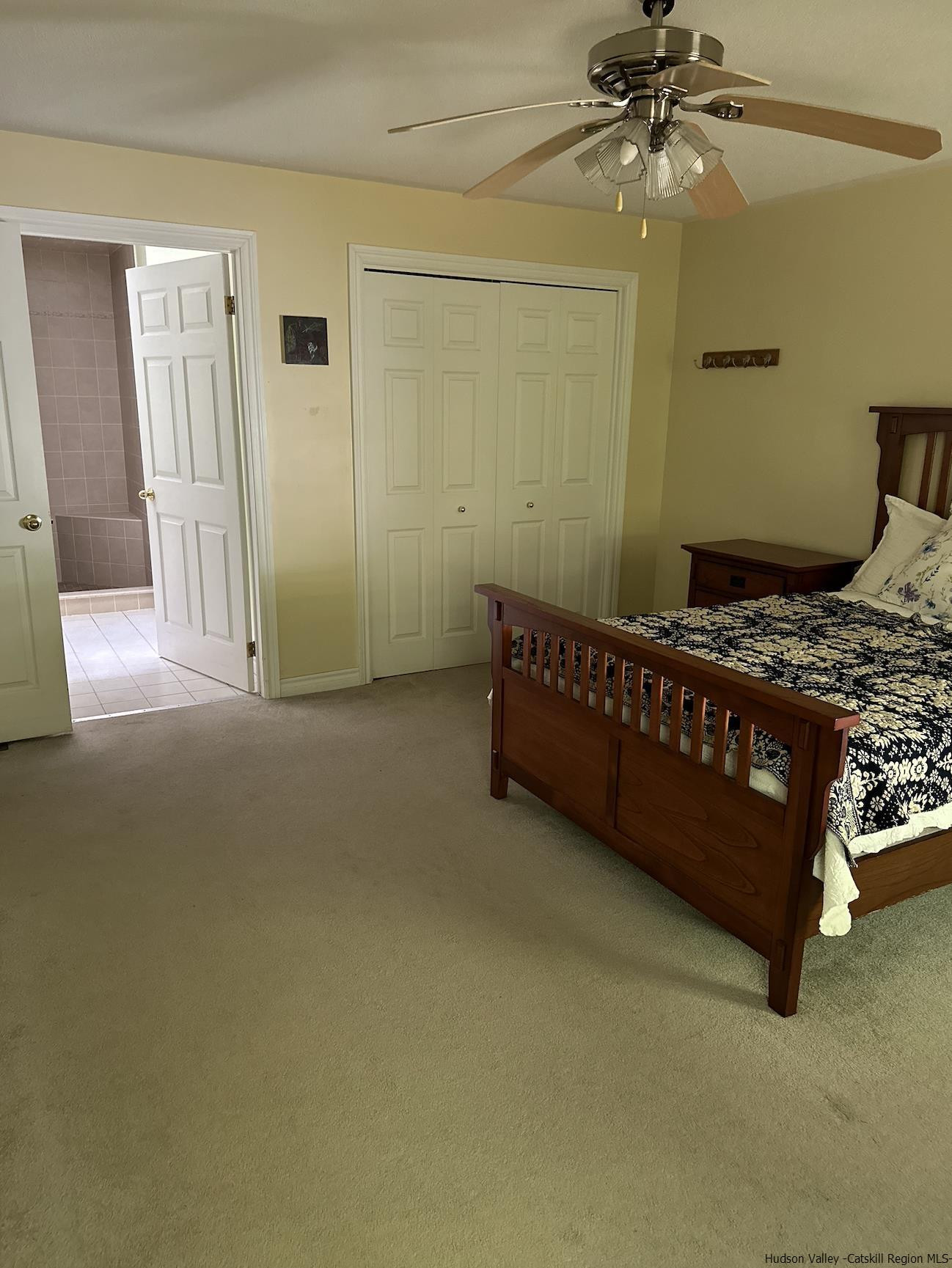 63 Lawrence Hill Road Accord, NY 12404 - Photo 13 of 19 a bedroom with a bed and a chandelier