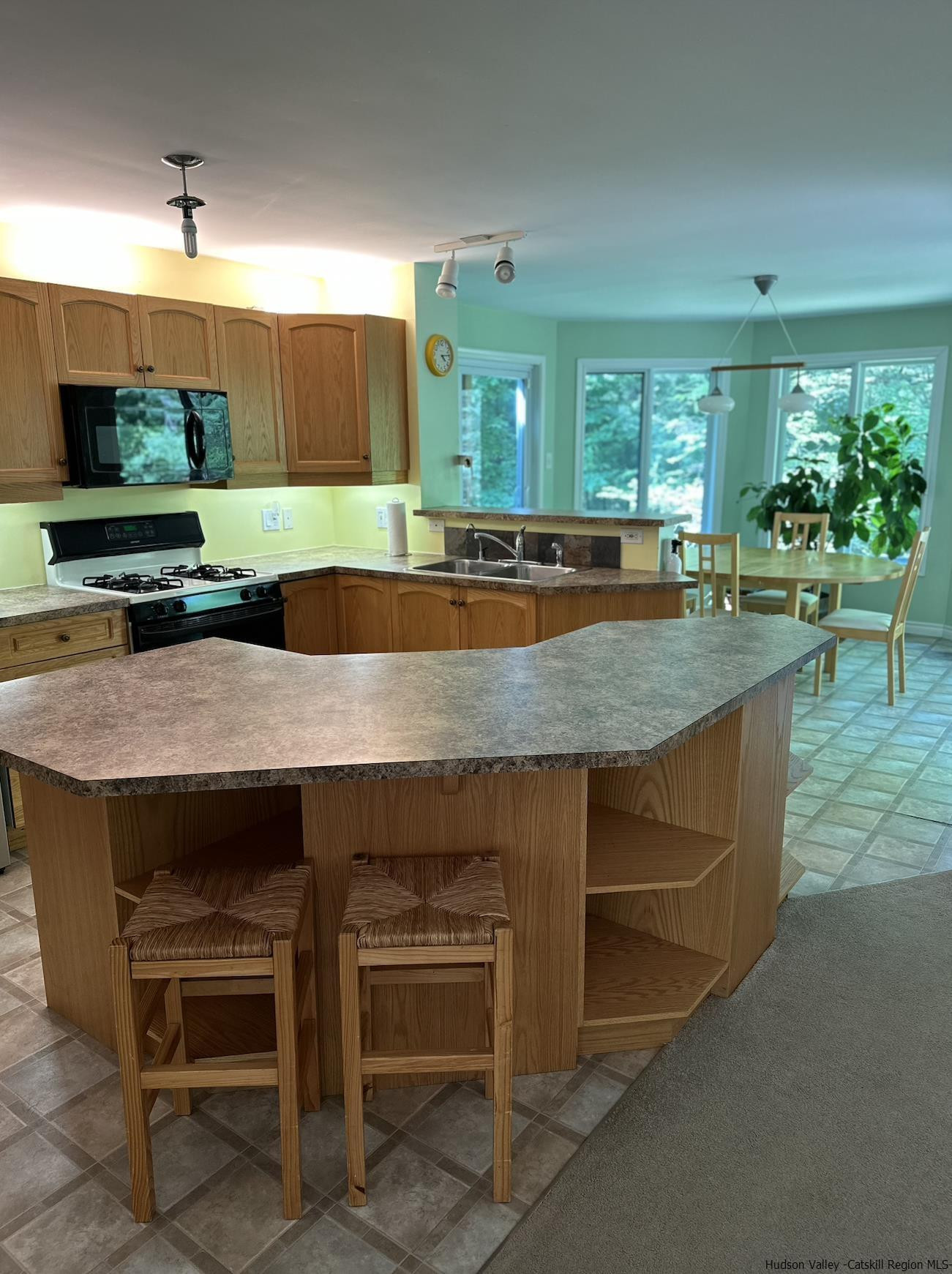63 Lawrence Hill Road Accord, NY 12404 - Photo 8 of 19 a kitchen with a table and chairs in it
