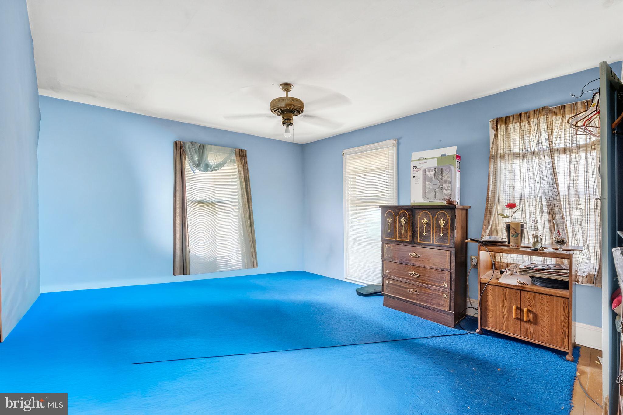 100 Penn Street Penns Grove, NJ 08069 - Photo 13 of 25 a view of an empty room with window and wooden floor