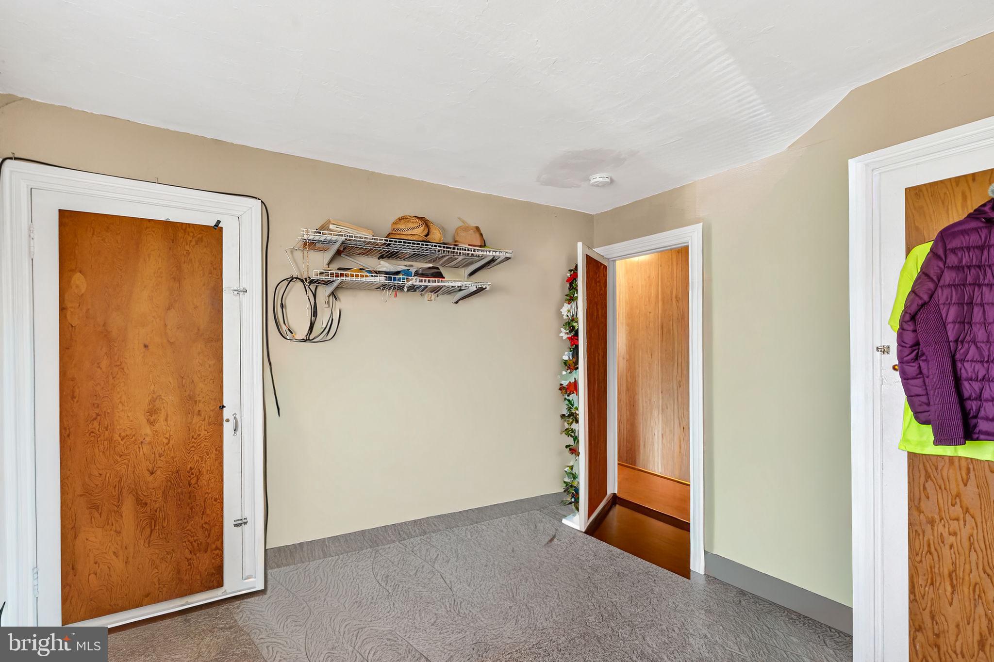 100 Penn Street Penns Grove, NJ 08069 - Photo 14 of 25 a view of a room with a flat tv screen and a swing kitchen