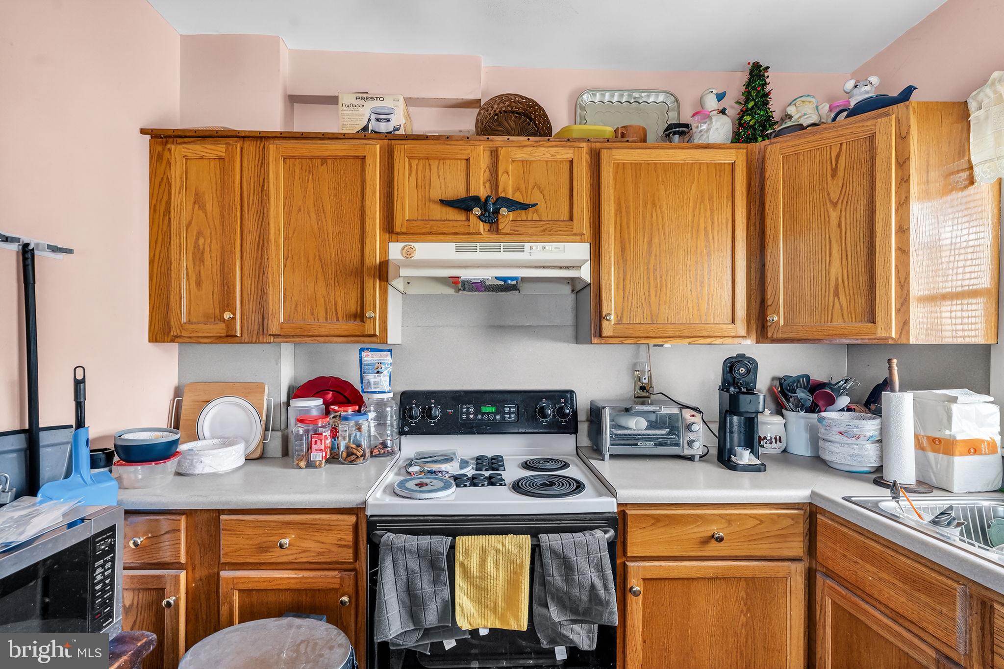 100 Penn Street Penns Grove, NJ 08069 - Photo 10 of 25 a kitchen with stainless steel appliances granite countertop a stove a sink and a cabinets