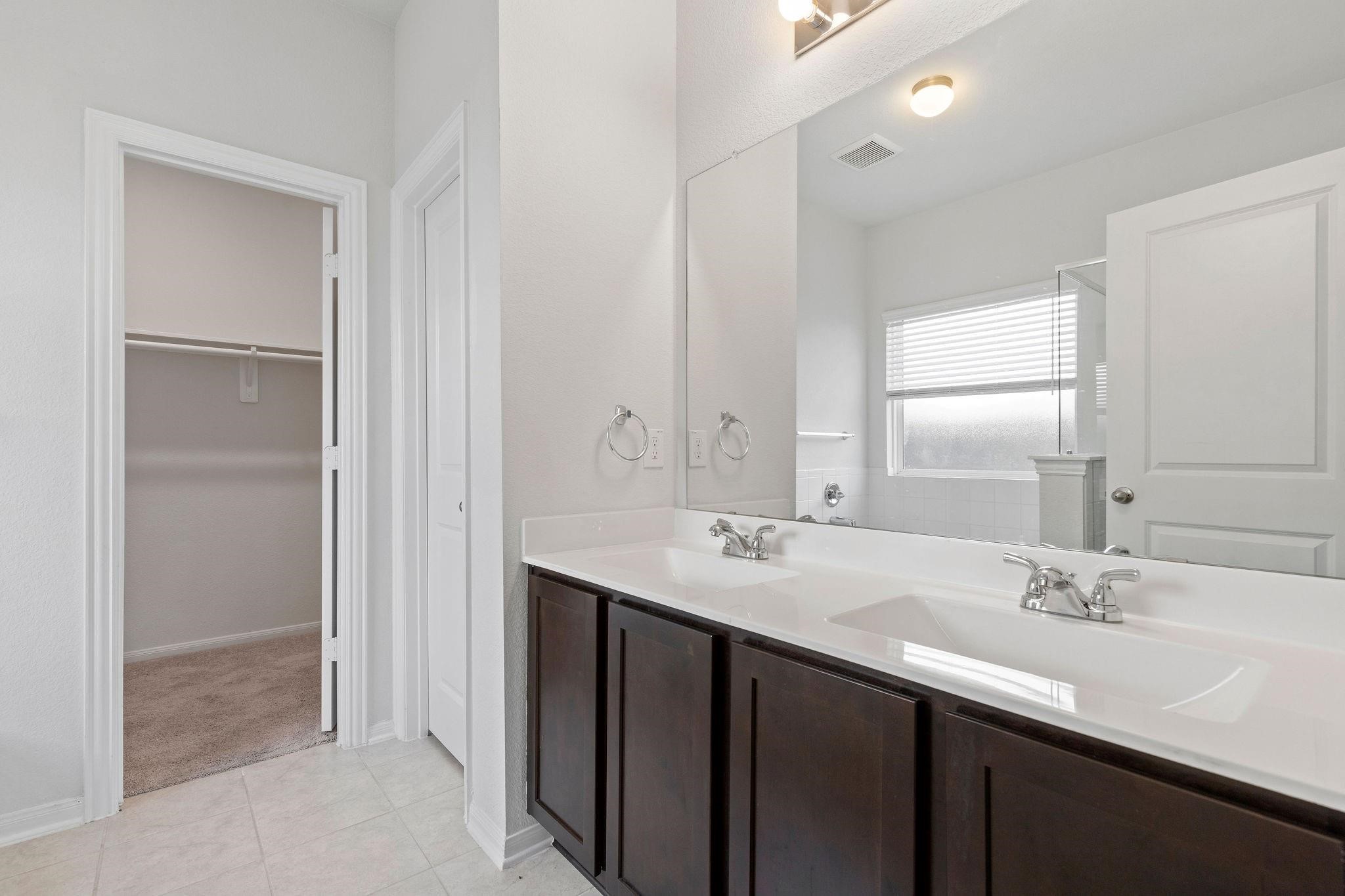 5319 Rivers Edge Drive Richmond, TX 77469 - Photo 12 of 23 a bathroom with a sink double vanity and a mirror
