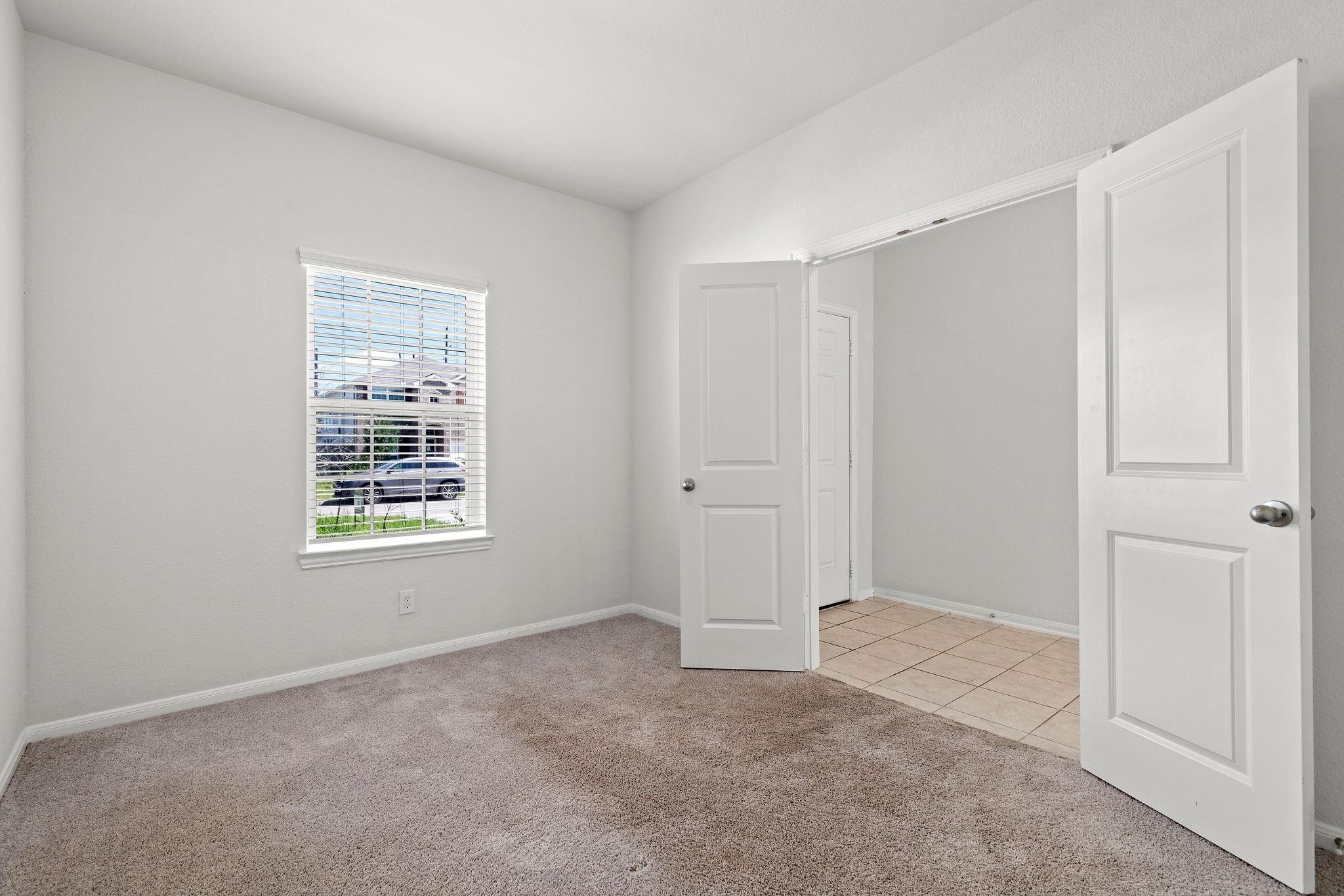 5319 Rivers Edge Drive Richmond, TX 77469 - Photo 14 of 23 a view of an empty room with a window