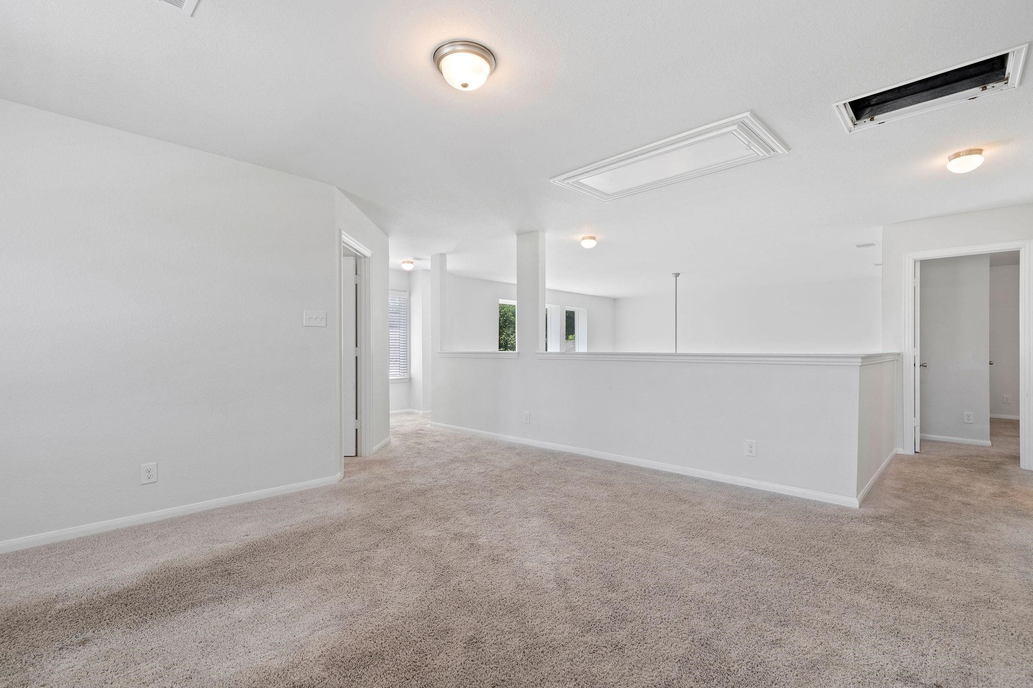 5319 Rivers Edge Drive Richmond, TX 77469 - Photo 16 of 23 an empty room with a kitchen and a sink