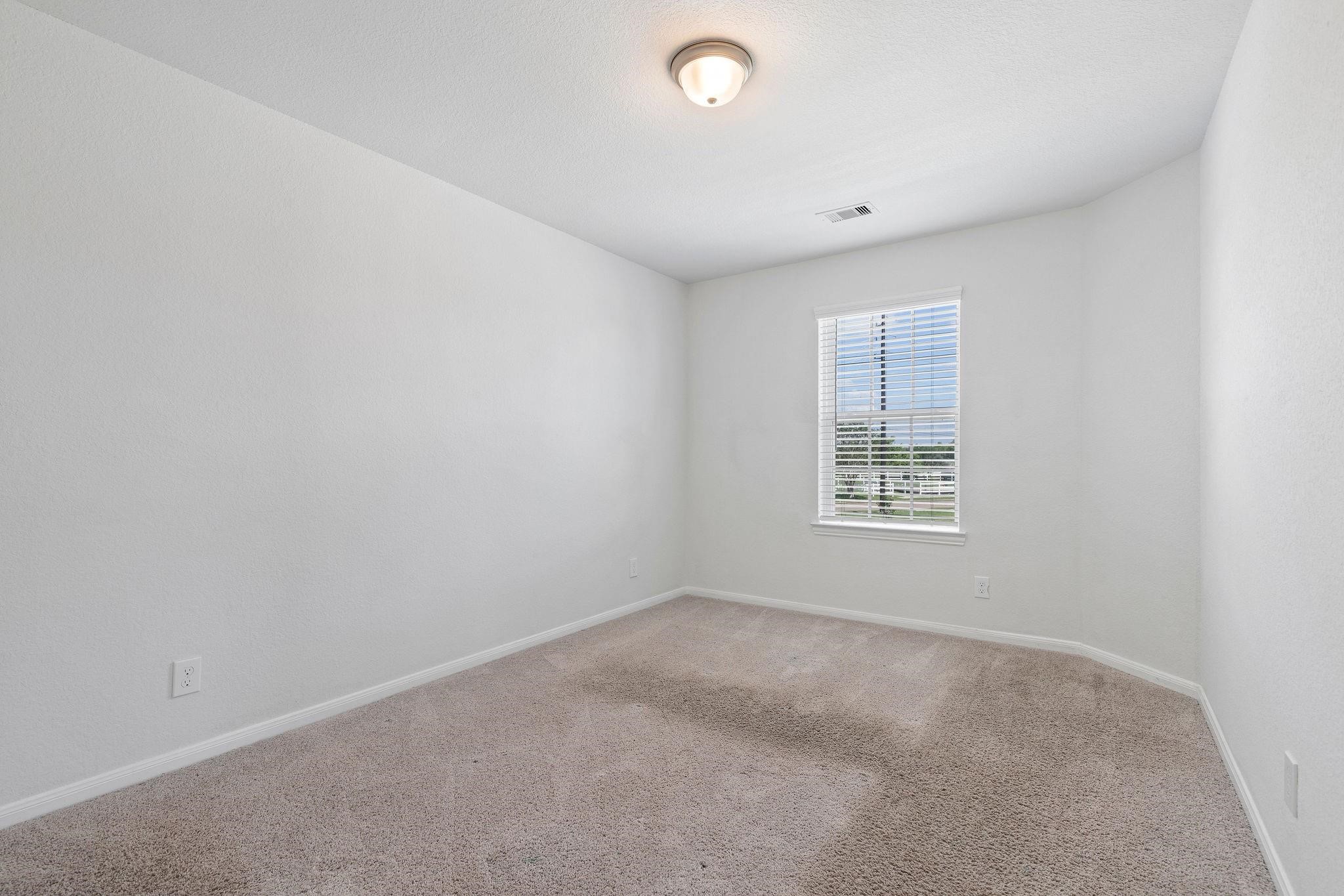 5319 Rivers Edge Drive Richmond, TX 77469 - Photo 18 of 23 an empty room with a window