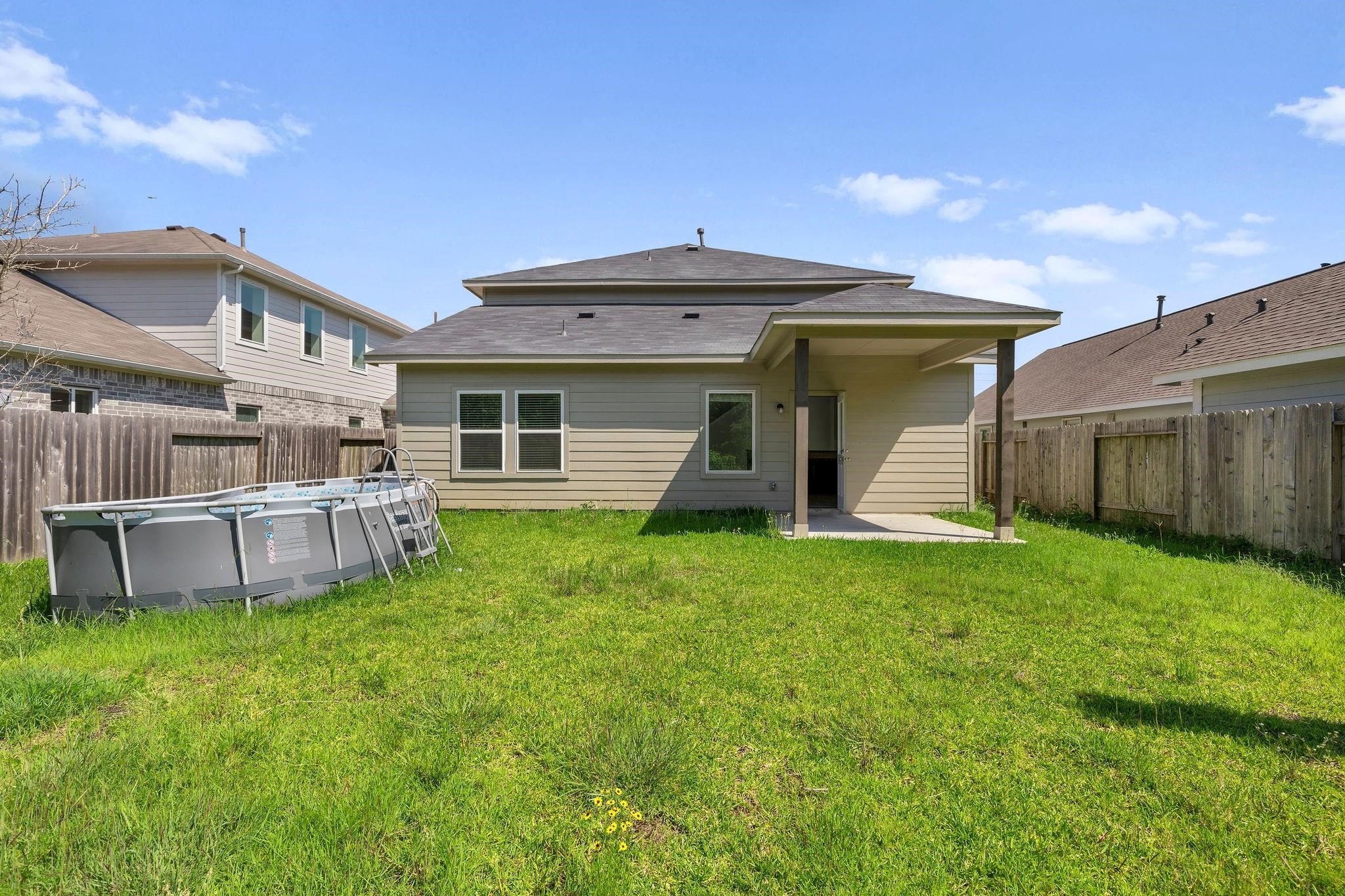 5319 Rivers Edge Drive Richmond, TX 77469 - Photo 22 of 23 a view of a house with a yard and sitting area