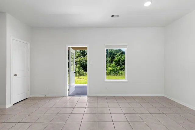 an empty room with windows