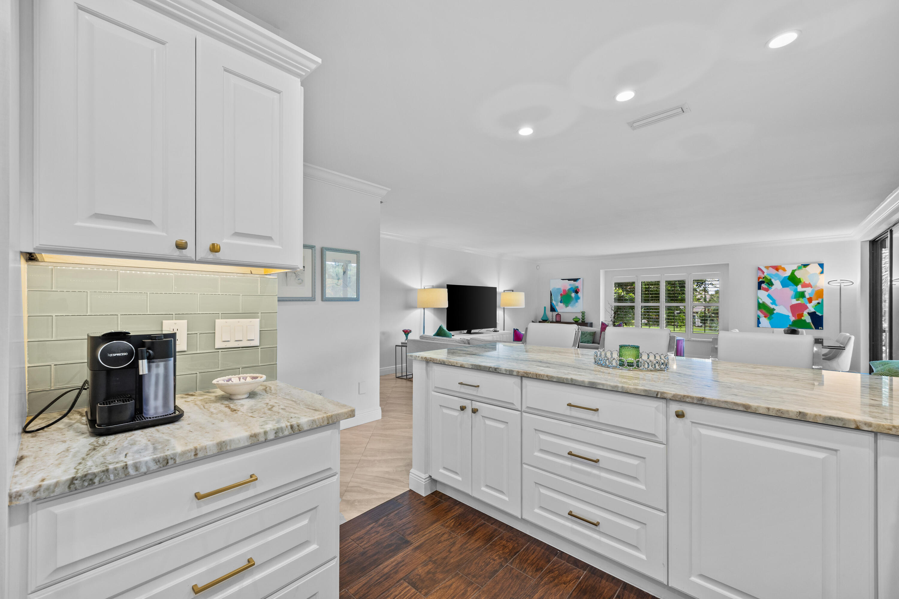 13254 Polo Club Road, Unit C204 Wellington, FL 33414 - Photo 7 of 29 a kitchen with white cabinets and sink
