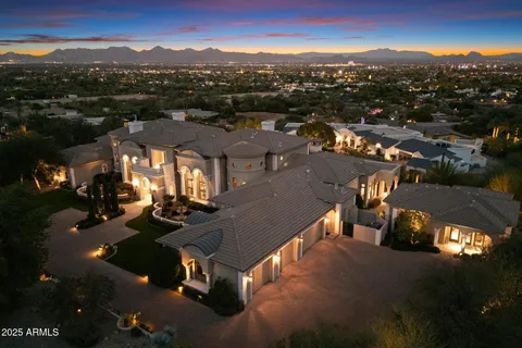 a living room with furniture fireplace and a large window